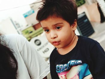 Portrait of boy looking at home