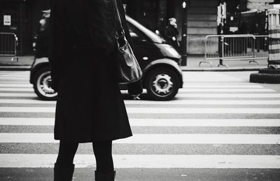 Woman walking on city street