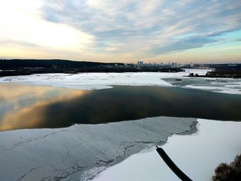 Scenic view of lake against sky during sunset