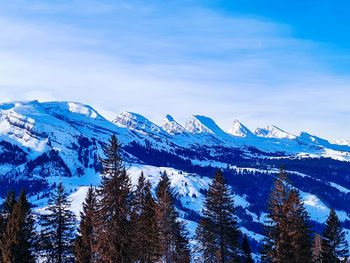 Scenic view of snowcapped mountains against sky