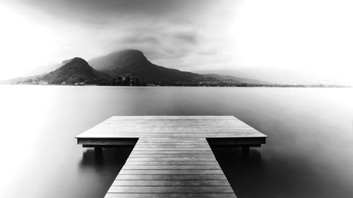 Pier over sea against sky