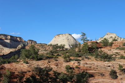 Panoramic view of landscape against clear blue sky