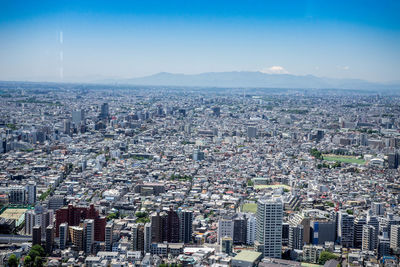 High angle view of modern buildings in city against sky