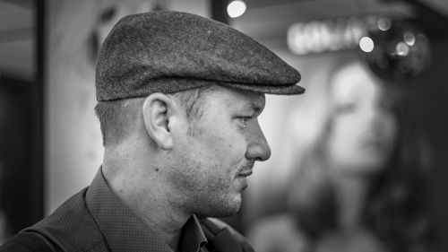 Side view of man wearing flat cap