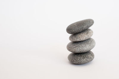 Stack of stones on white background
