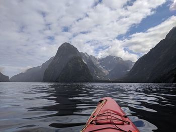 Scenic view of lake and mountains against sky