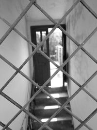 Full frame shot of metal fence against wall