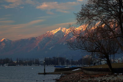 Scenic view of lake against sky during sunset