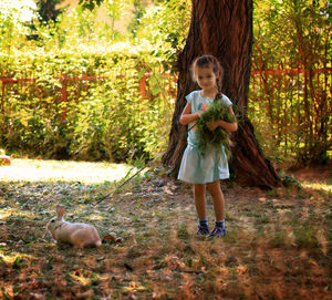 Full length of a girl standing on land