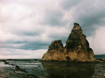 Scenic view of sea against cloudy sky