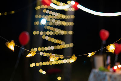 Close-up of illuminated string lights at night