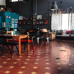 Empty chairs and tables in cafe