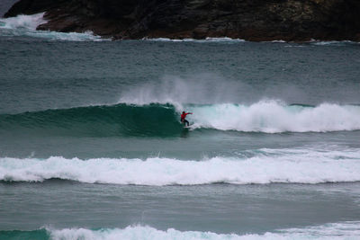 Scenic view of waves rushing towards shore