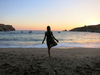 Woman at beach during sunset