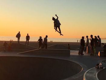 People enjoying at sunset
