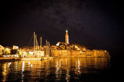 Illuminated buildings in city at night