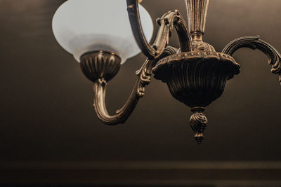 Low angle view of chandelier hanging from ceiling