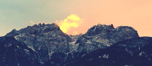 Scenic view of rock formation against sky during sunset