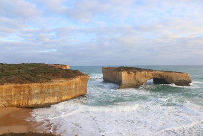 Scenic view of sea against cloudy sky