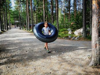 Woman standing in forest