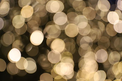 Defocused image of illuminated lights at night