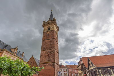 Low angle view of clock tower against sky