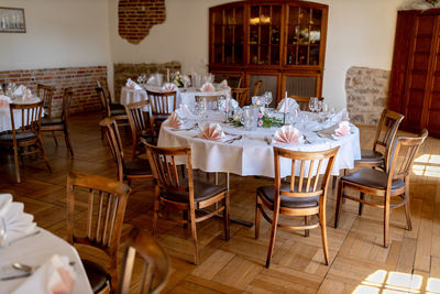 Empty chairs and tables in restaurant