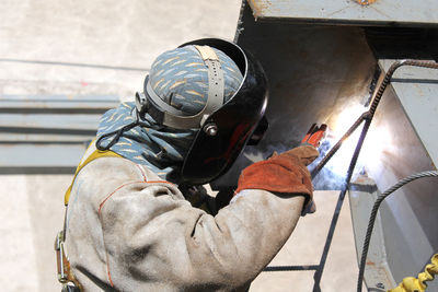 Welder working at construction site