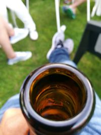 Cropped image of hand holding coffee cup