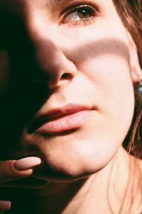 Close-up portrait of young woman looking away