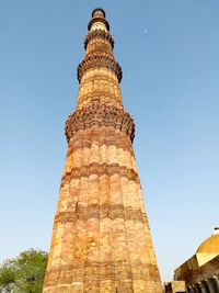 Low angle view of historical building against clear blue sky