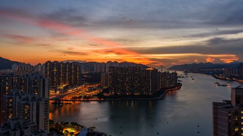 Illuminated city at sunset