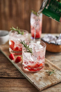 Close-up of drinks on wooden table