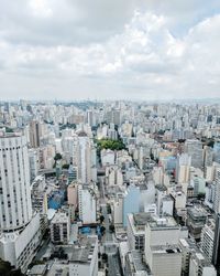 Aerial view of cityscape against sky