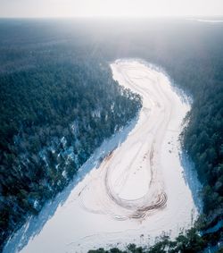 High angle view of snowy landscape against sky