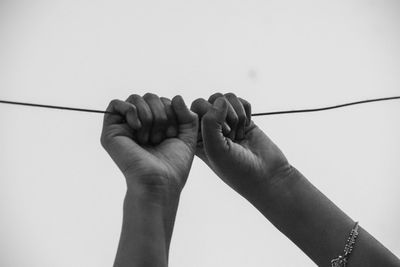 Close-up of hand against white background