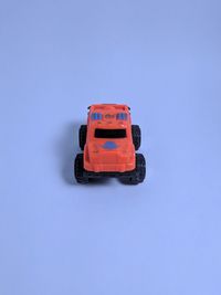 Close-up of toy car against blue background