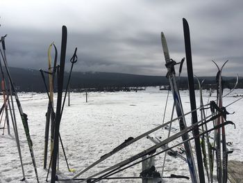 Scenic view of snow covered field against sky