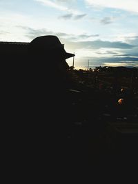 Silhouette man against sky during sunset