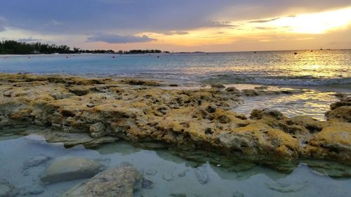 Scenic view of sea against sky at sunset