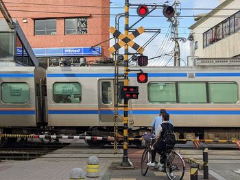 Train on railroad track in city