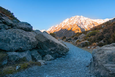 Scenic view of rocky mountains against clear blue sky