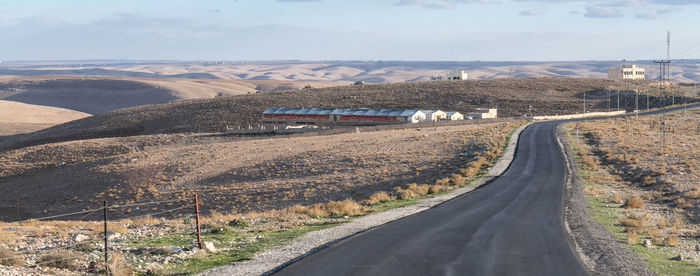 Road amidst landscape against sky