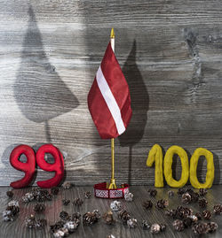 High angle view of flags on wooden table