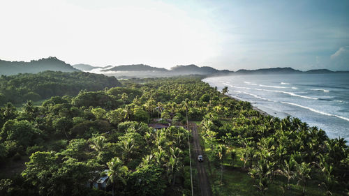 High angle view road trip between sea and jungle