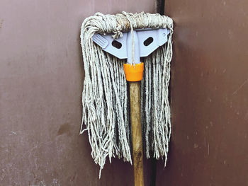 Close-up of rope tied on wall