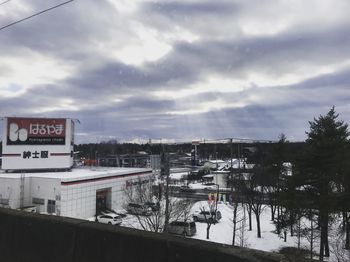 Text on snow against sky during winter