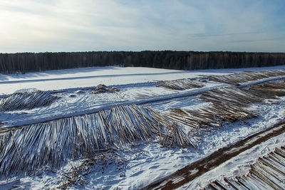 Scenic view of frozen lake against sky during winter