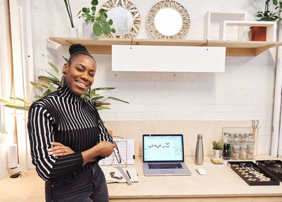 Portrait of businesswoman standing at office