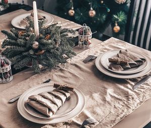 High angle view of dining table decorated at home during christmas